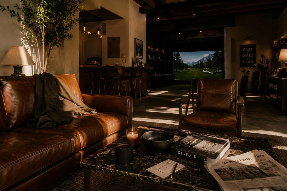 The clubhouse lounge with the golf simulator beyond
